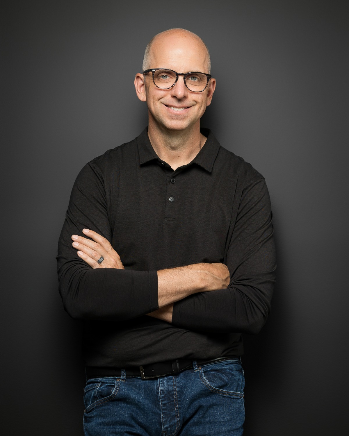 Pat Miller, arms crossed, in a black shirt