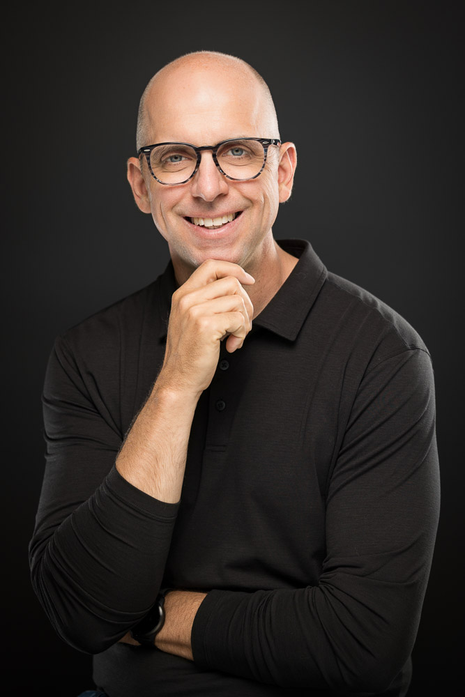 Pat Miller smiling, hand on chin
